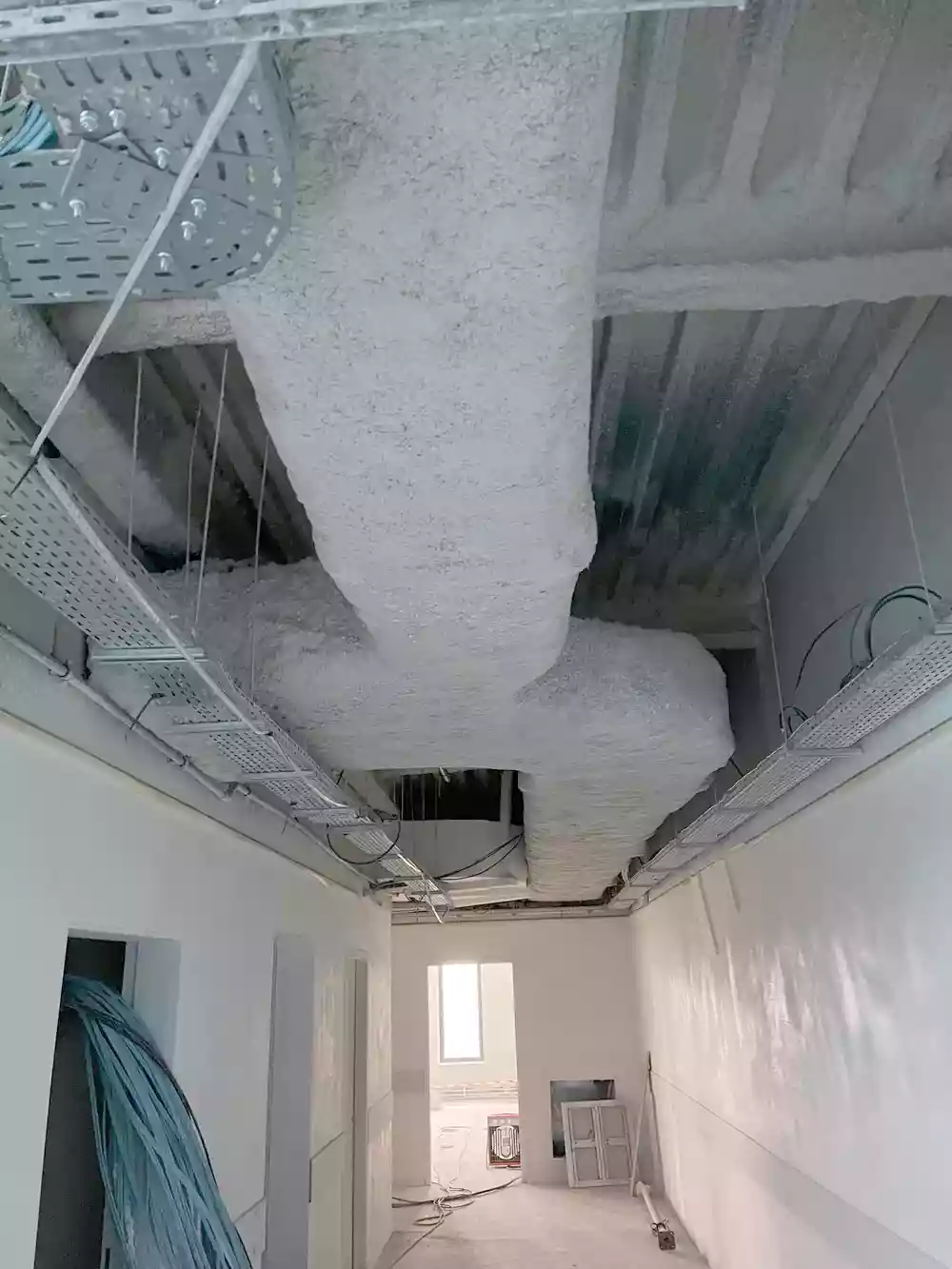 Flocage d'une gaine de désenfumage — chantier Castor